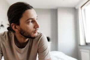 A man thinking about the signs of clinical depression